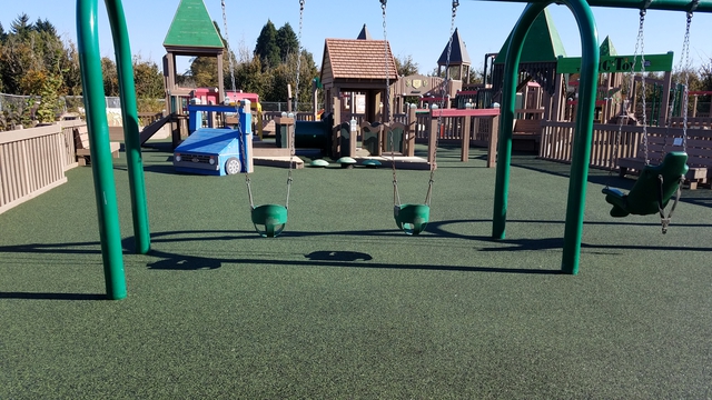 swings and playground at big toy in Keizer Rapids Park